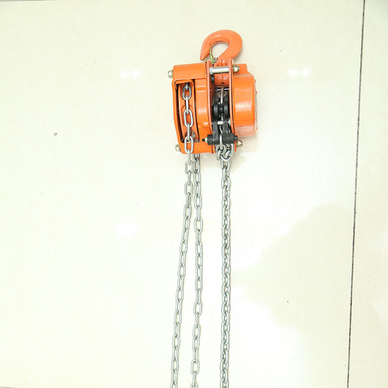 Orange chain hoist side view with hand chain