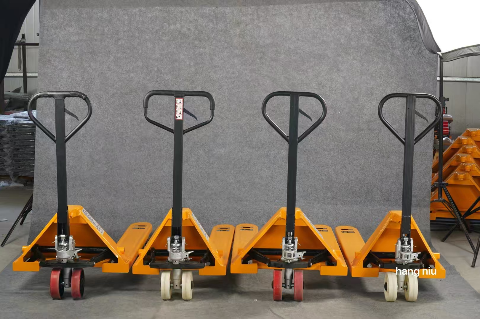 Multiple hand pallet trucks in workshop